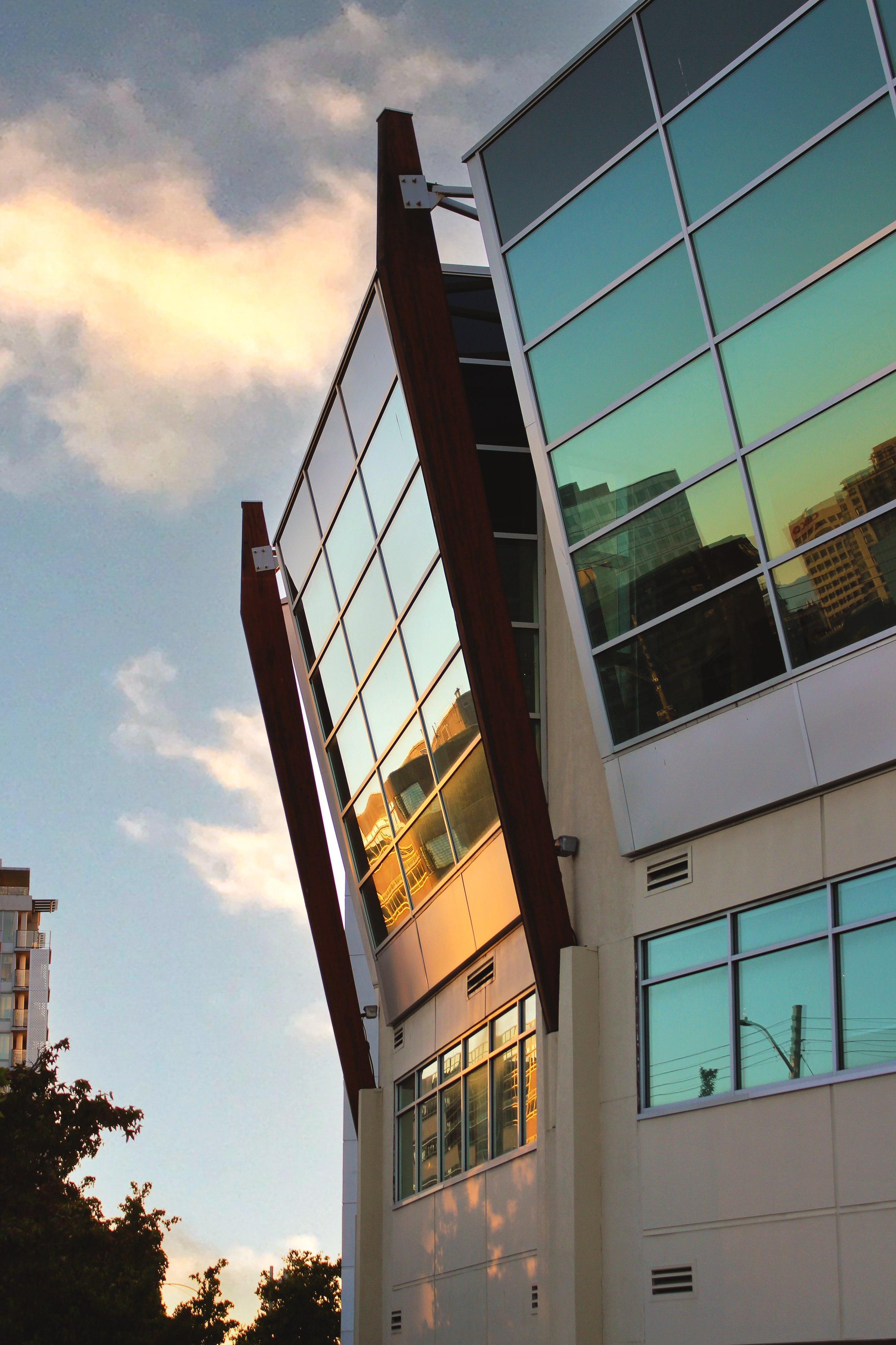 Glass office building at sunset